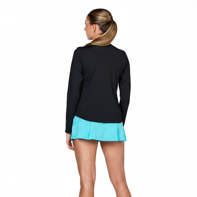 back view of a woman wearing a black quarter zip long sleeve UV protection top with an aqua colored tennis skort