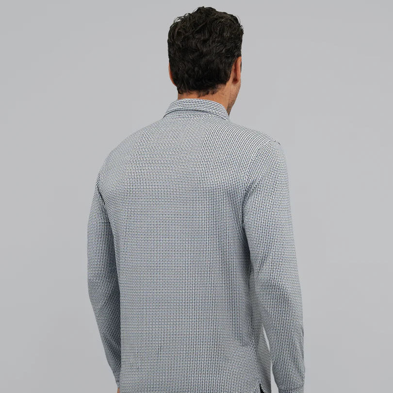 Man wearing a UV Protection geometric print long-sleeve shirt and black shorts on a gray background