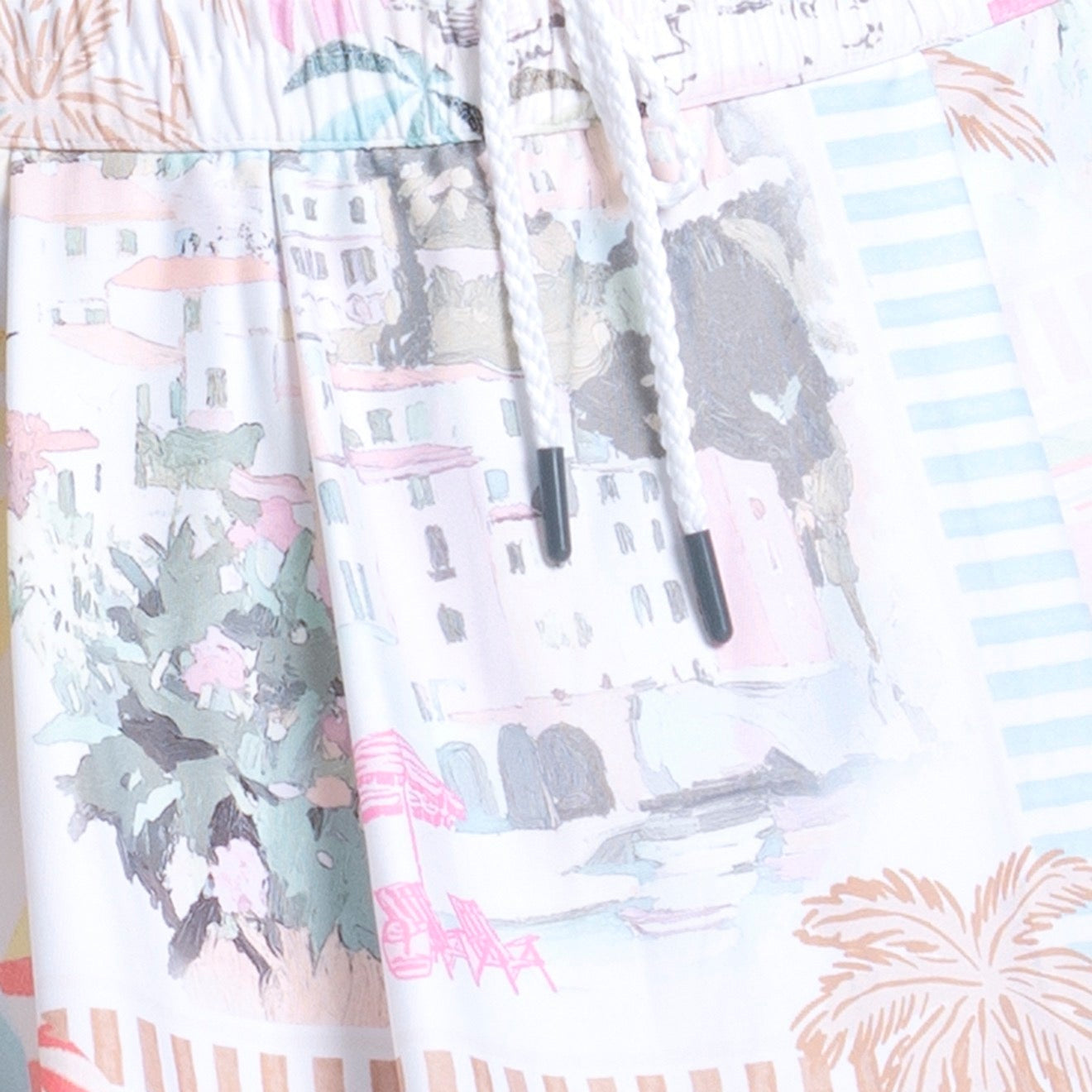 Fabric swatches with various pastel patterns including floral, striped, and palm tree designs.