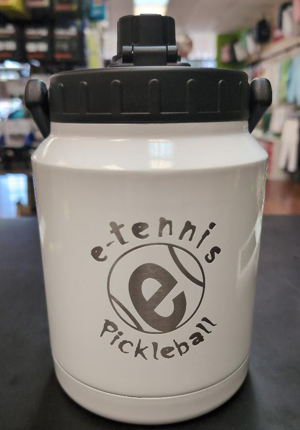 White jug with black lid featuring 'e-tennis pickleball' branding on a dark surface.