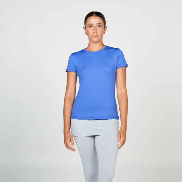 Woman wearing a blue t-shirt and gray leggings on a white background