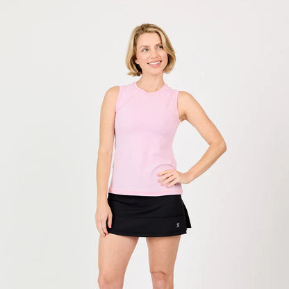 Woman wearing a pink sleeveless top and black tennis skirt on a white background