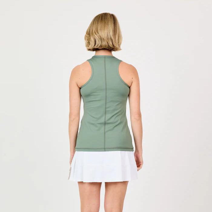 Back view of a woman wearing a green sleeveless top and white skirt on a light gray background