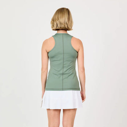 Back view of a woman wearing a green sleeveless top and white skirt on a light gray background