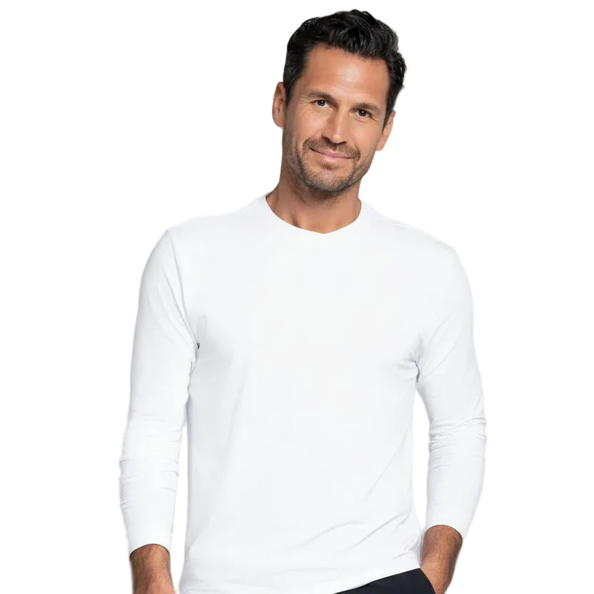 Man wearing a white long-sleeve shirt and black shorts on a gray background