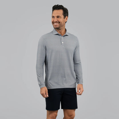 Man wearing a UV Protection geometric print long-sleeve shirt and black shorts on a gray background