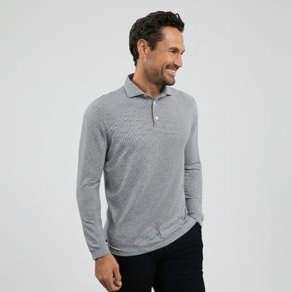 Man wearing a UV Protection geometric print long-sleeve shirt and black shorts on a gray background