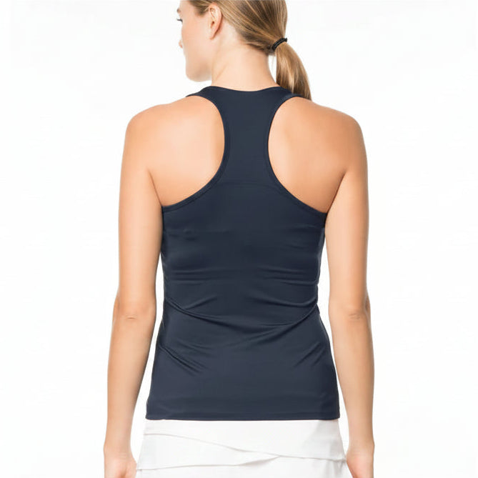 Back view of woman wearing a navy racer back tank top and white skirt on a white background
