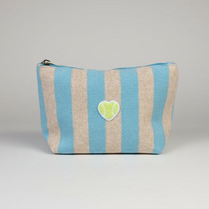 Striped pouch with a heart-shaped patch on a gray background