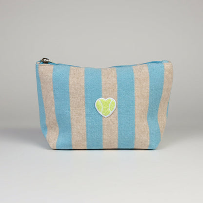 Striped pouch with a heart-shaped patch on a gray background