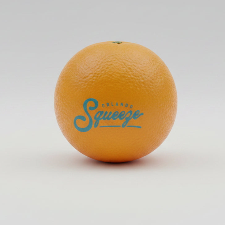 Squishy foam orange with 'Orlando Squeeze' logo on a reflective surface