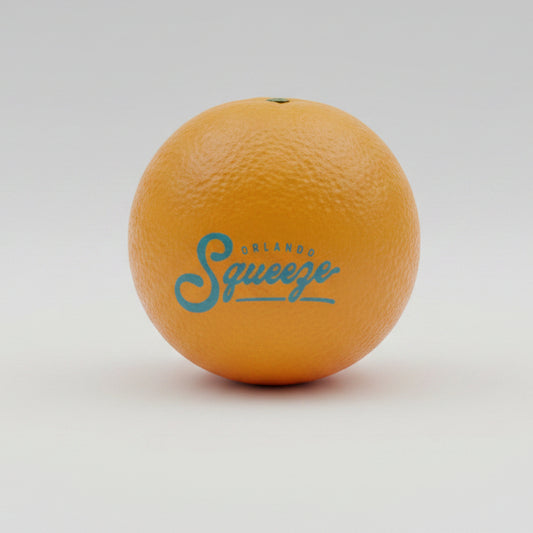 Squishy foam orange with 'Orlando Squeeze' logo on a reflective surface