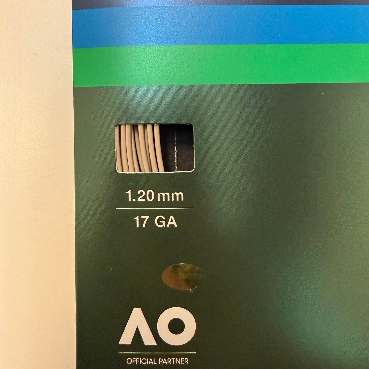 Yonex Poly Tour Pro 1.20mm | 17 GA polyester tennis string packaging sleeve, featuring a blue and green design with athlete portraits and the Yonex logo.