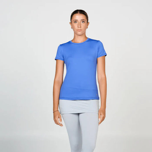 Woman wearing a blue t-shirt and gray leggings on a white background